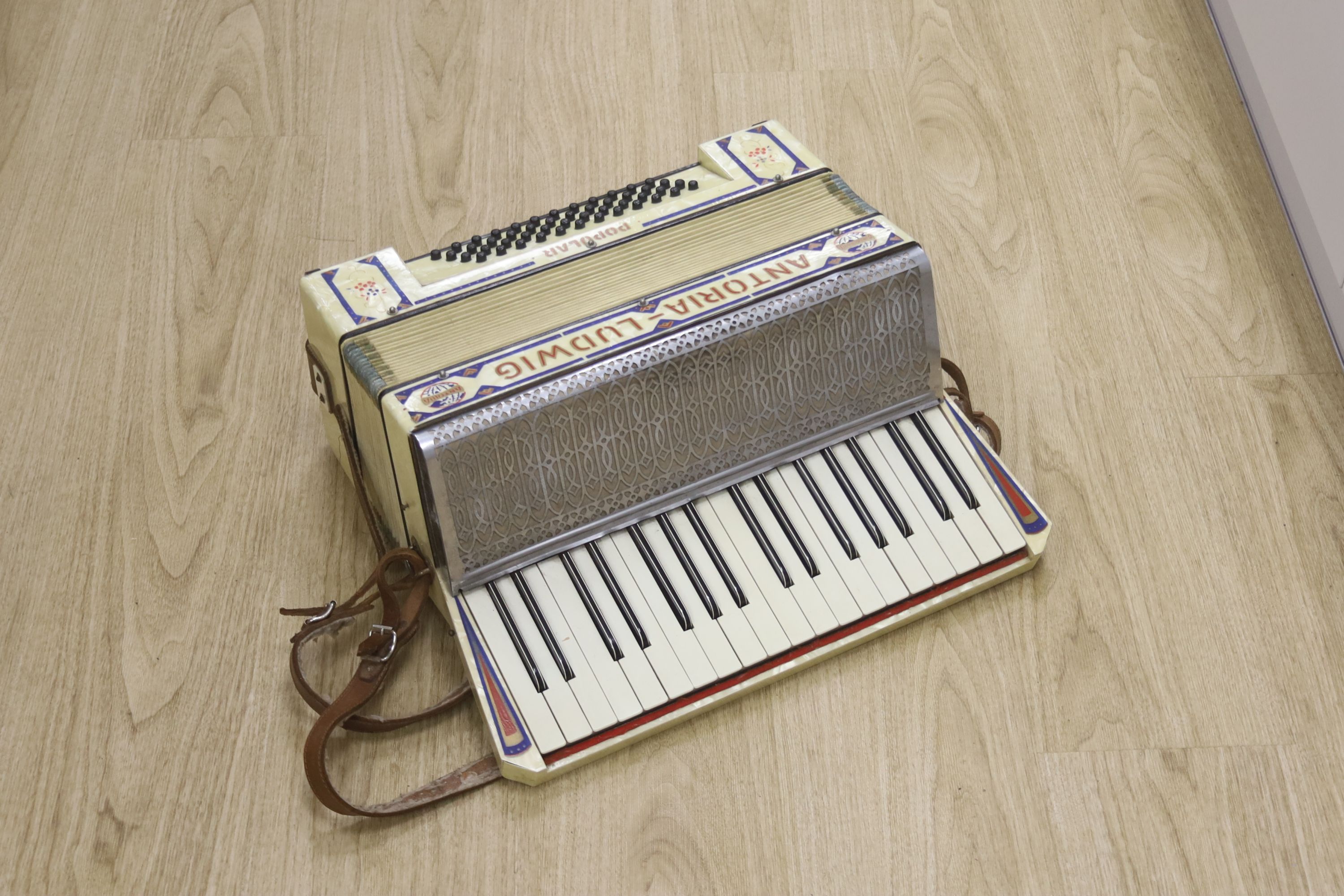 A cased Antoria Ludwig accordian, cased